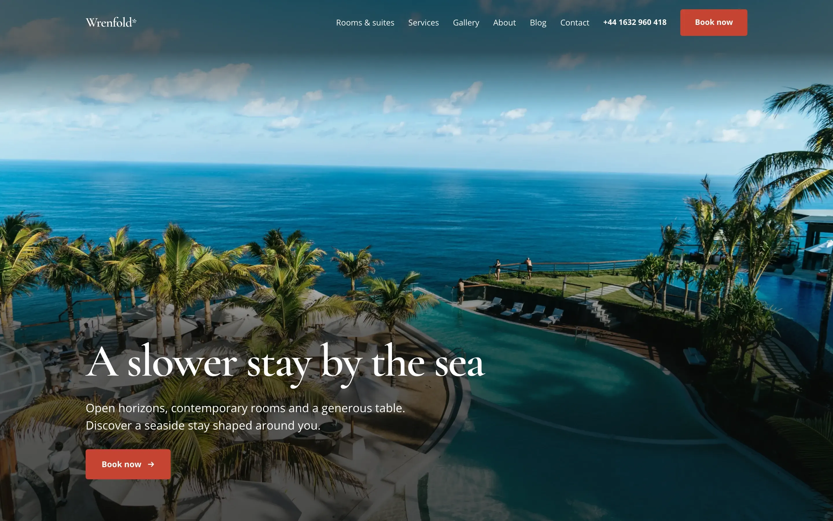 Wrenfold hotel website template, the opening screen with a pool and sea view on a desktop